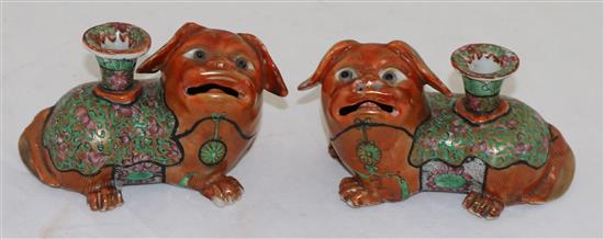 A pair of Chinese export enamelled porcelain Buddhist lion vases, mid 19th century, length 12.5cm